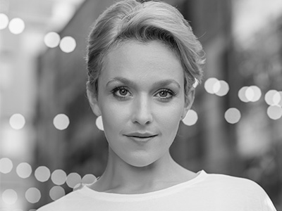 Black and white headshot of Rhian Lois