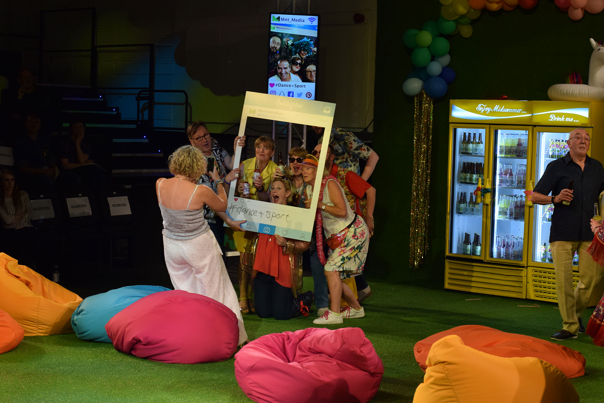 Scene with actors in a pretend booth for a photoshoot