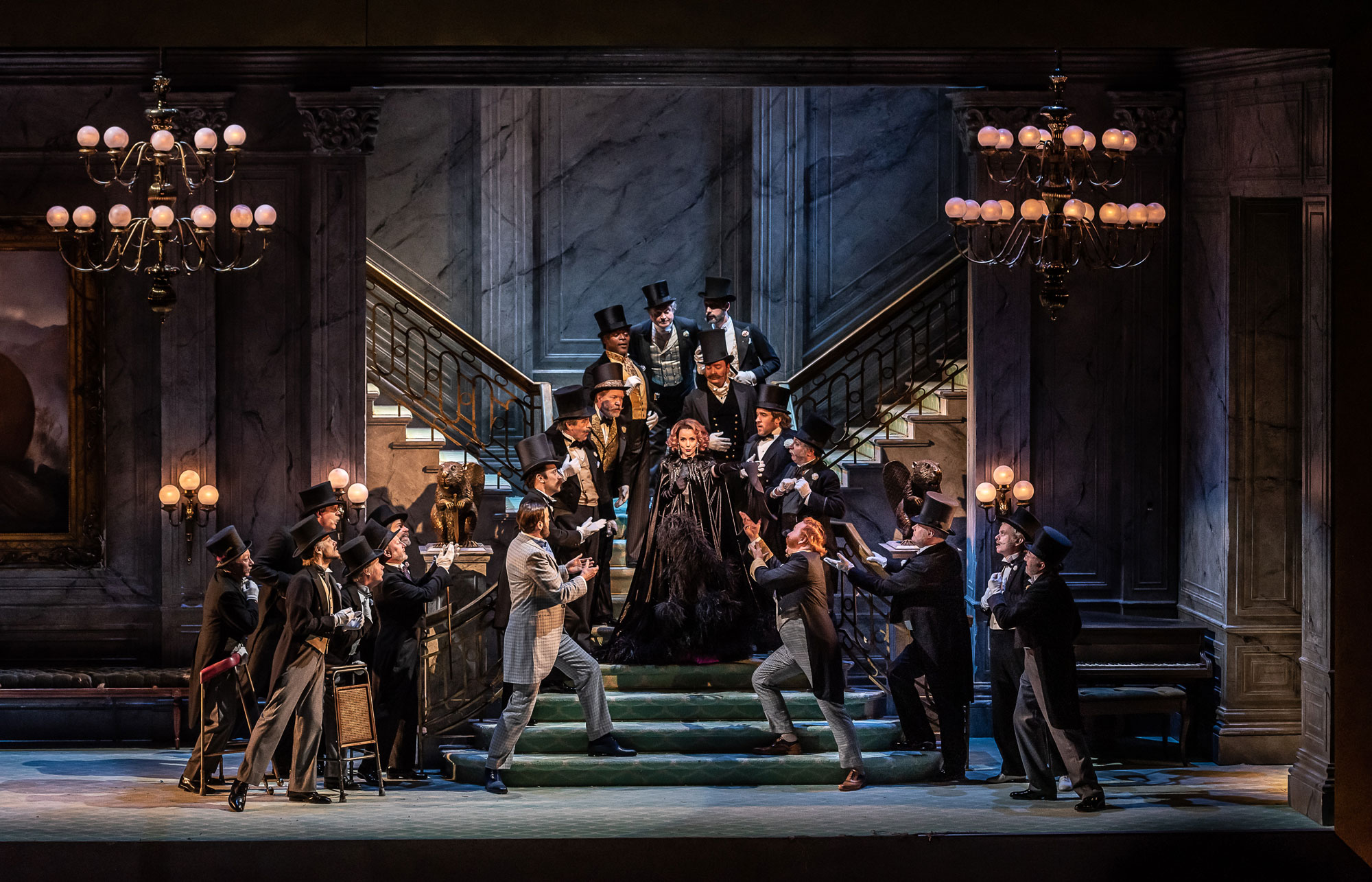 ENO The Merry Widow: Sarah Tynan and the Gentlemen of the ENO Chorus (c) Clive Barda