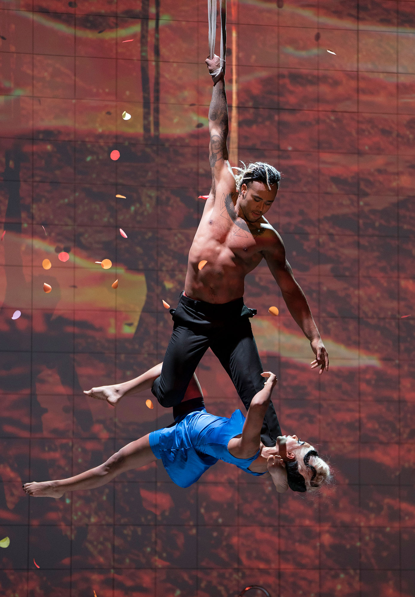 Man and woman hanging from a rope