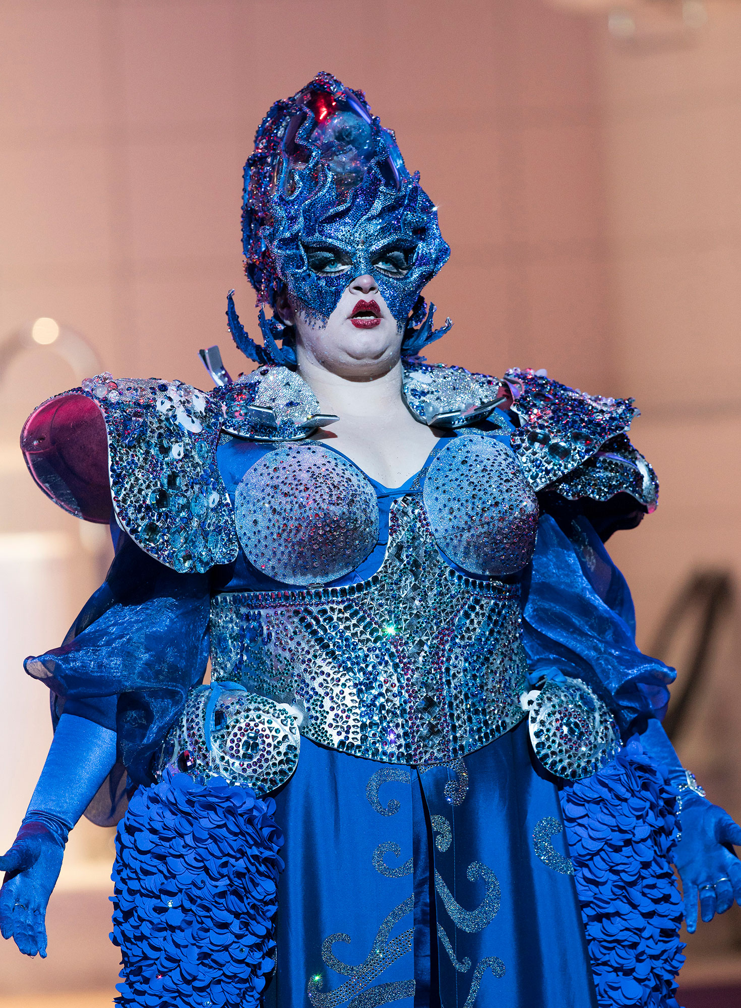Woman all in blue on stage