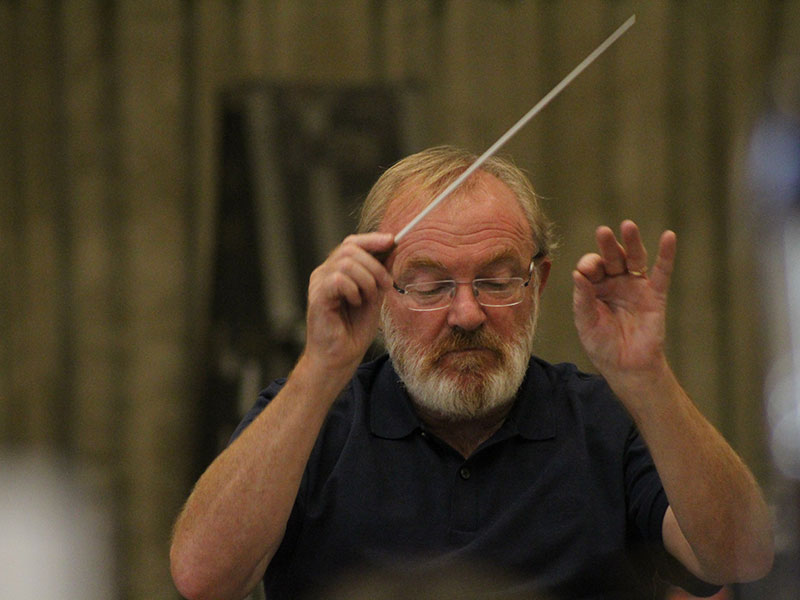 ENO1920 The Mask of Orpheus: Martyn Brabbins conducting with baton