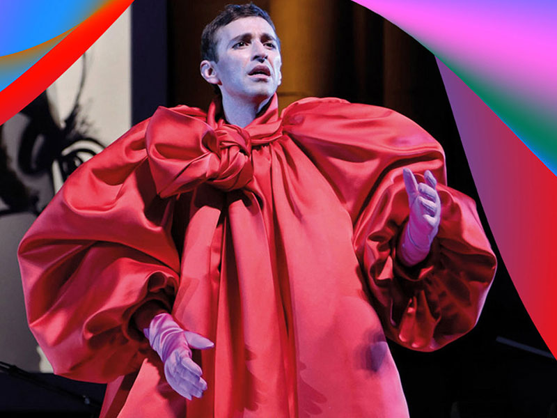 Anthony Roth Costanzo wearing bright red costume performing at the BBC Proms